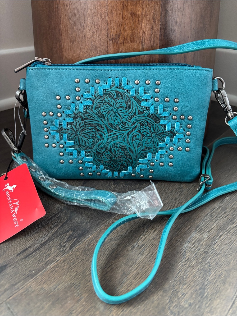 Montana West Wristlet,zip top & interior,tooled floral,suede stitching,studs